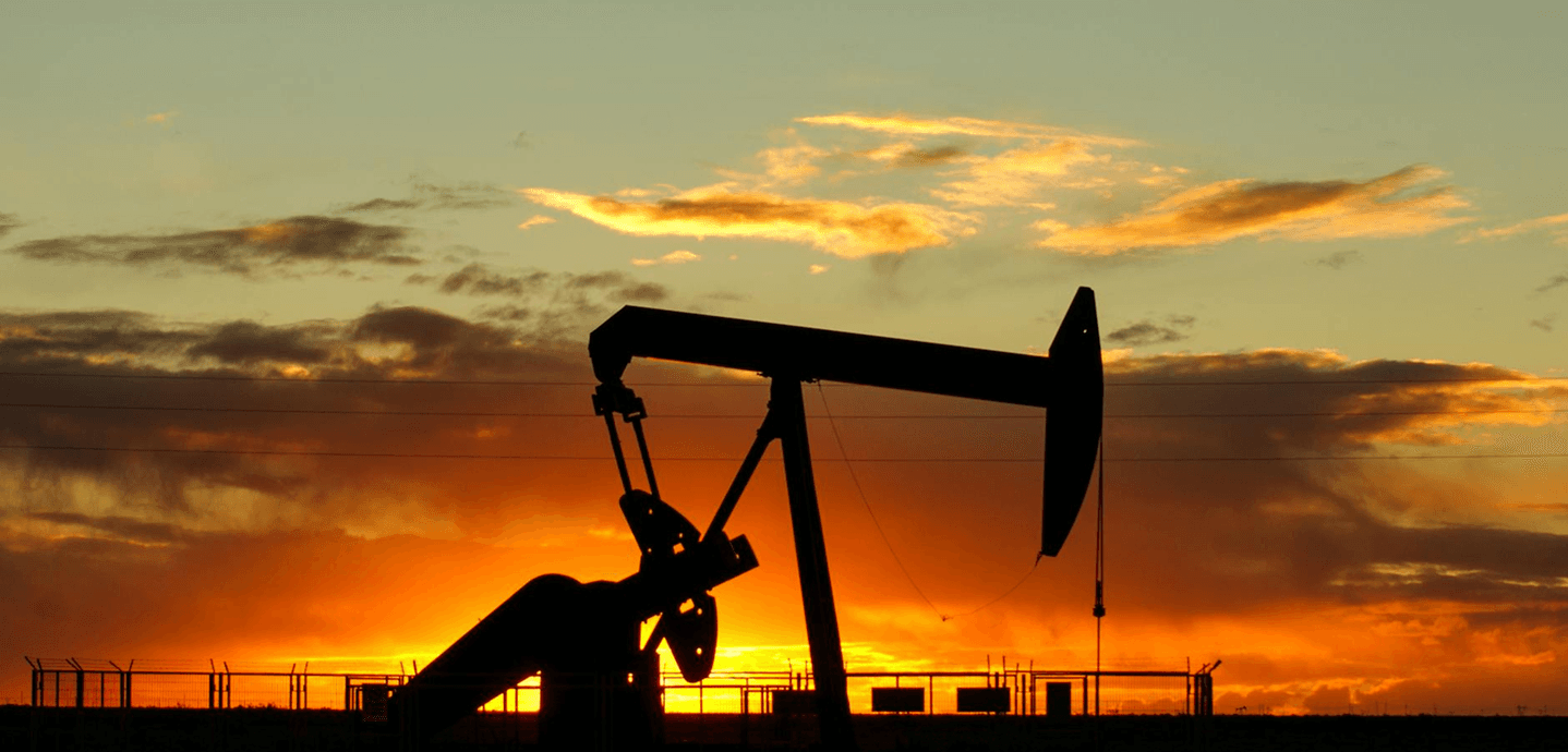Oil pumpjack at sunset